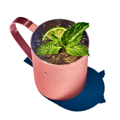 Enjoy a moscow mule drink in a classic copper mug.