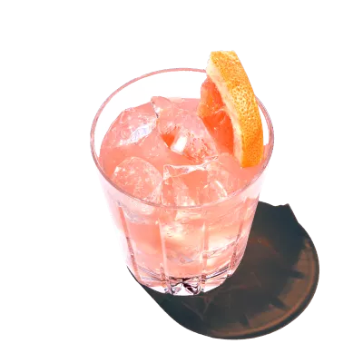 A glass of a Spicy Paloma is served with ice cubes and vodka from Pinnacle Vodka.